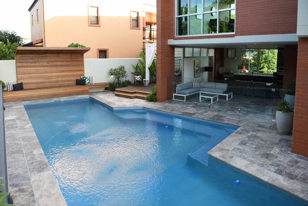 Outdoor entertaining area beside a pool in Carindale