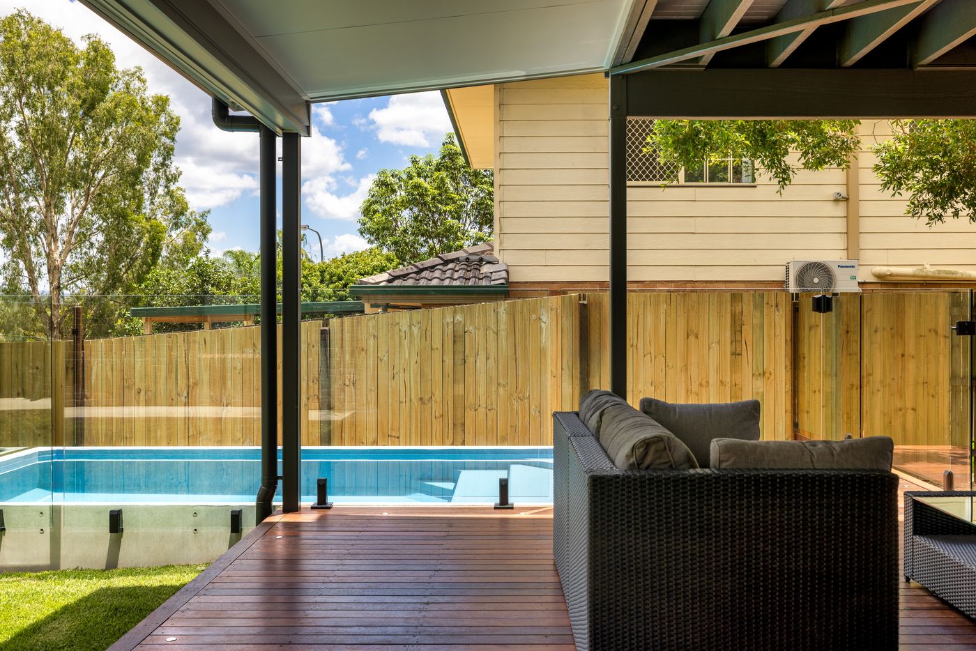 Covered timber deck beside a pool in Westlake