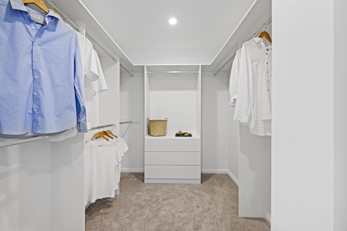 Walk-in robe with custom shelving and hanging space