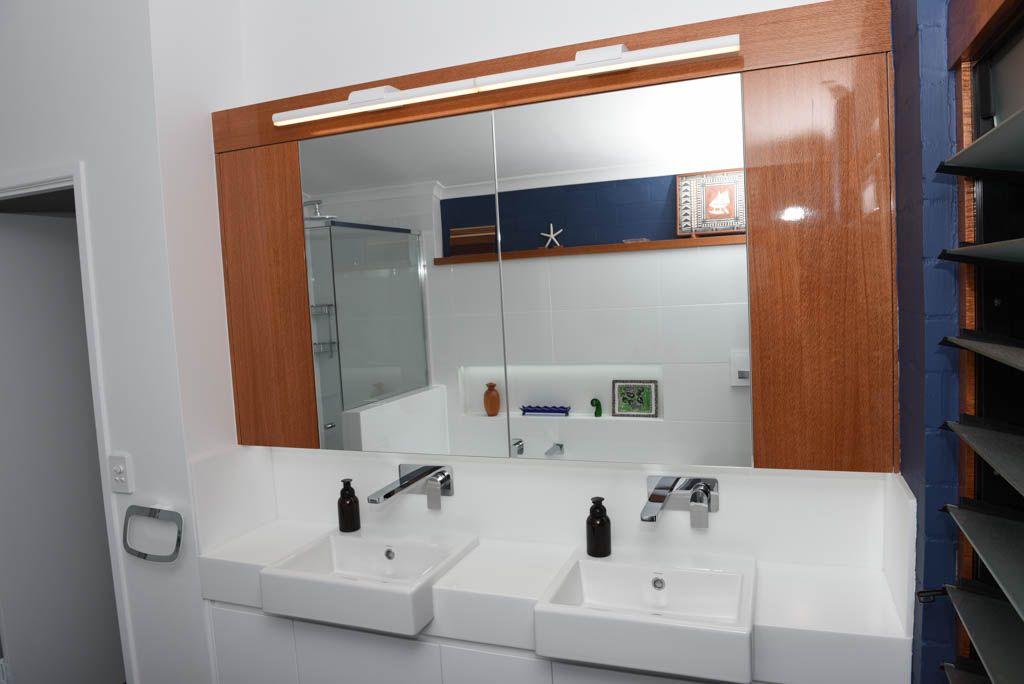 Yeronga bathroom with Corian benchtop and silky oak cabinetry
