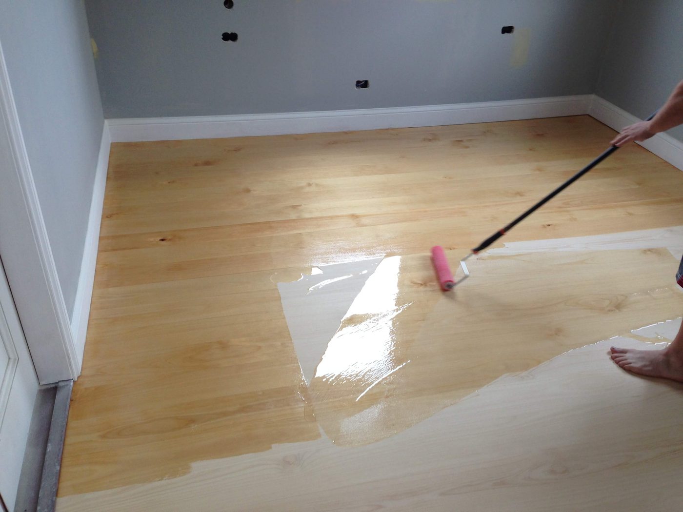 New timber floors being coated