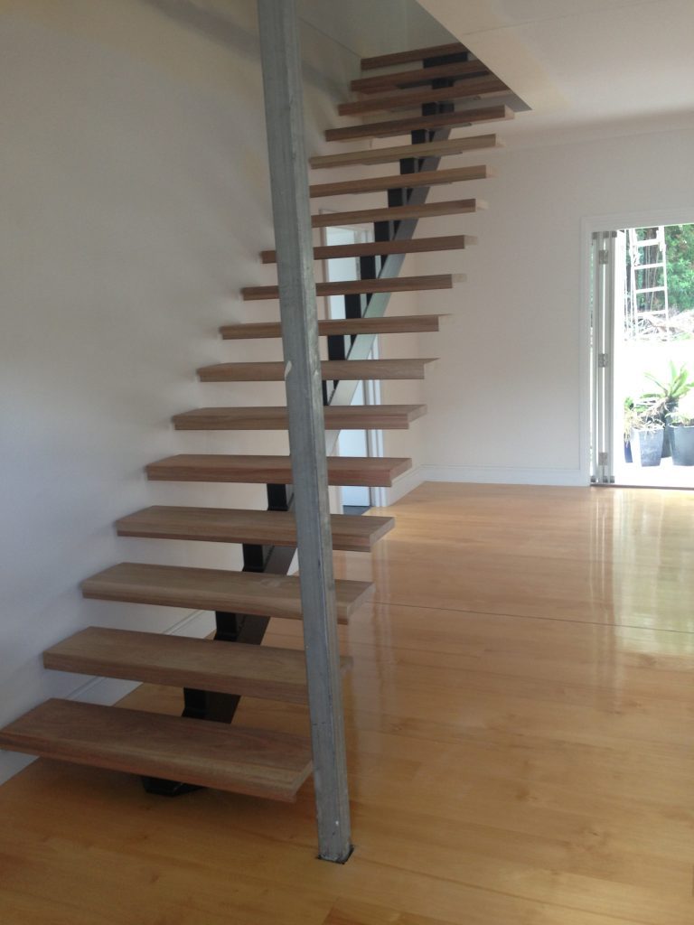 Mono-stringer staircase with spotted gum treads linking the two levels