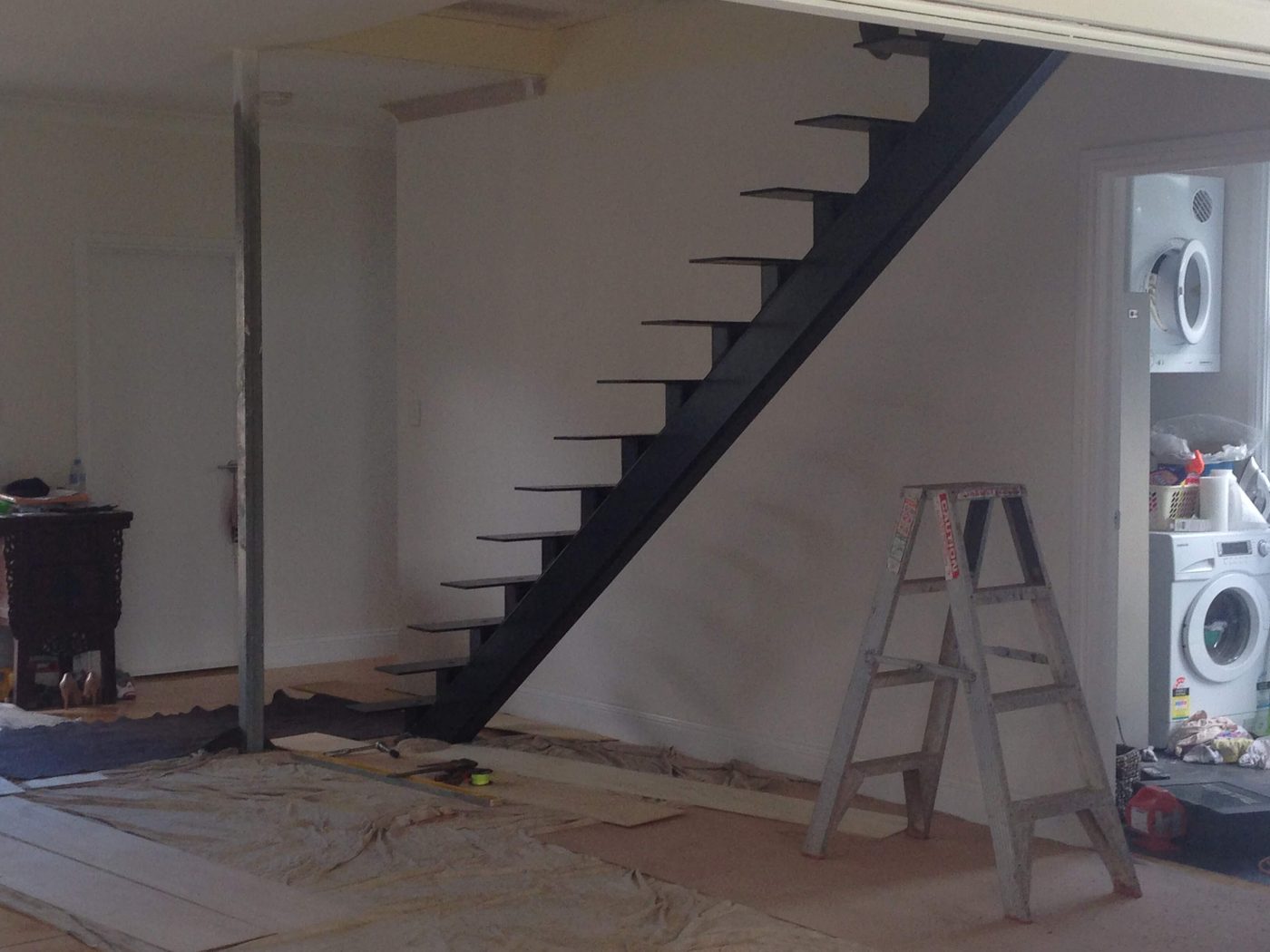Steel stringer for the new staircase being installed