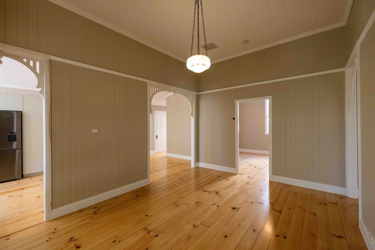 Renovated Queenslander living area with timber arches in Balmoral