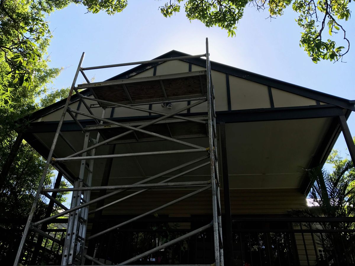 Scaffold tower set up for gable repairs on a Clayfield Queenslander