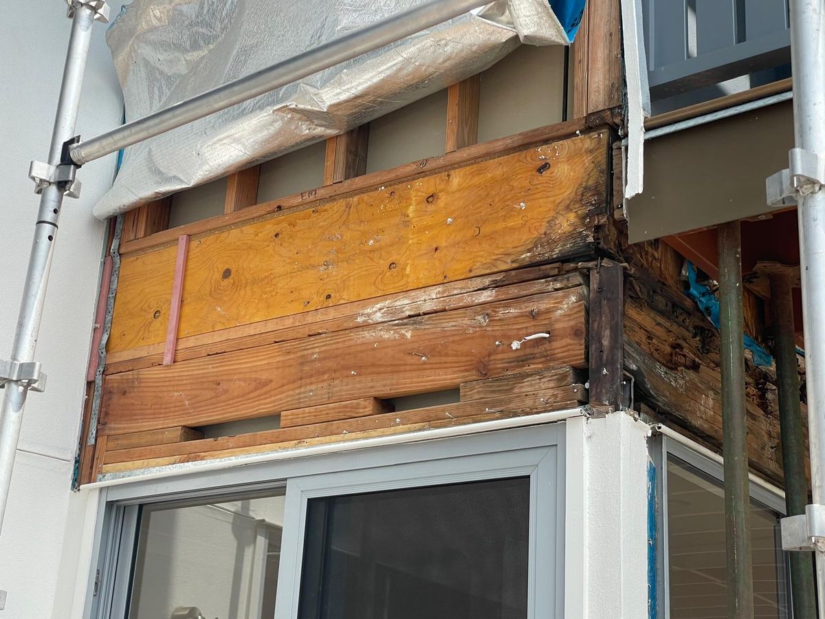 New timber going into repaired wall framing above a sliding door