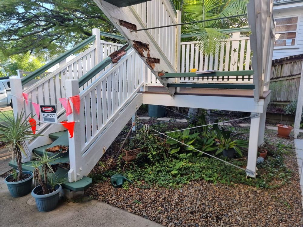 Old Queenslander stairs taped off because of rotten timber