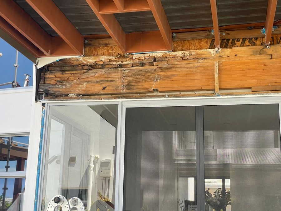 Rotten timber beam above sliding doors