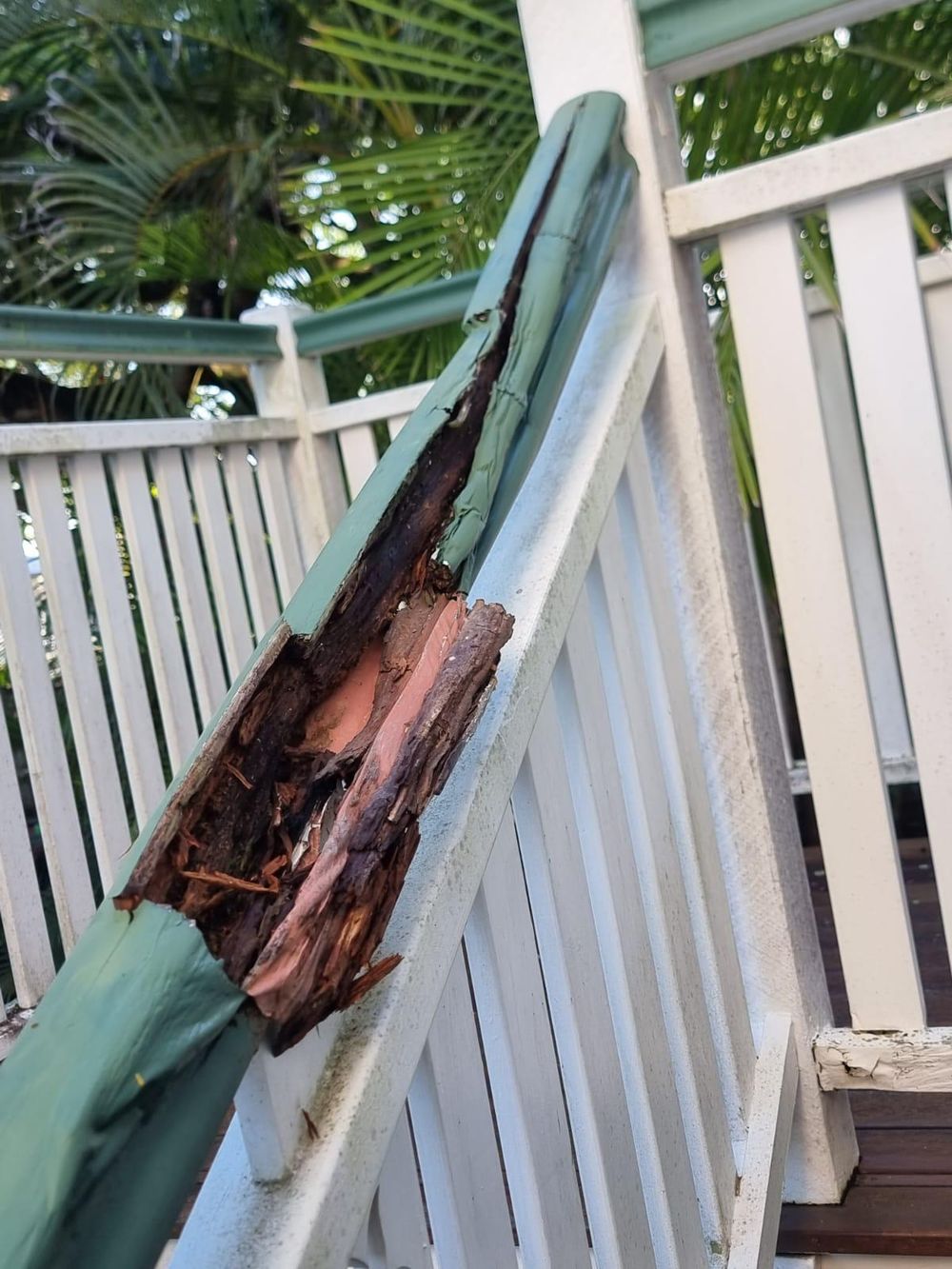 Rotten timber handrail and stringer on old Queenslander stairs